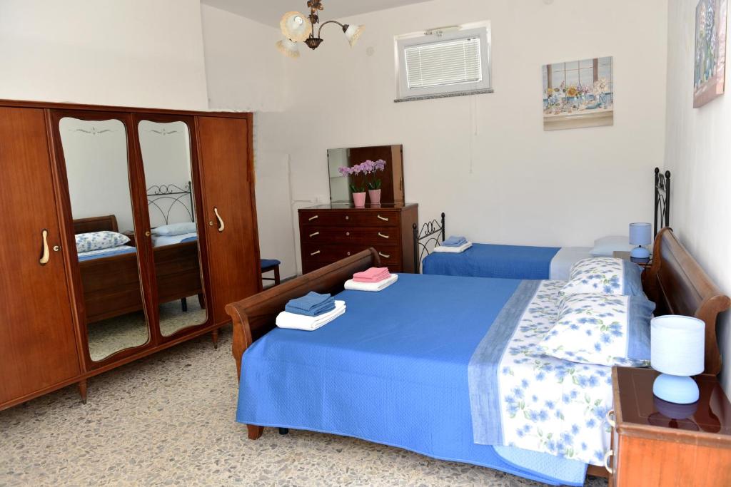 Ένα ή περισσότερα κρεβάτια σε δωμάτιο στο Casetta Virginia