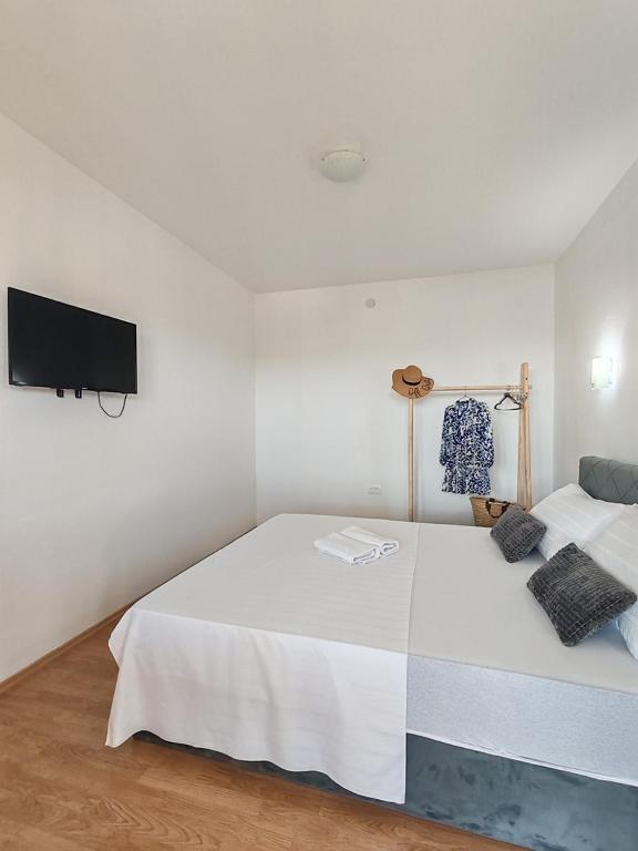 Postel nebo postele na pokoji v ubytování Apartments Lucerna
