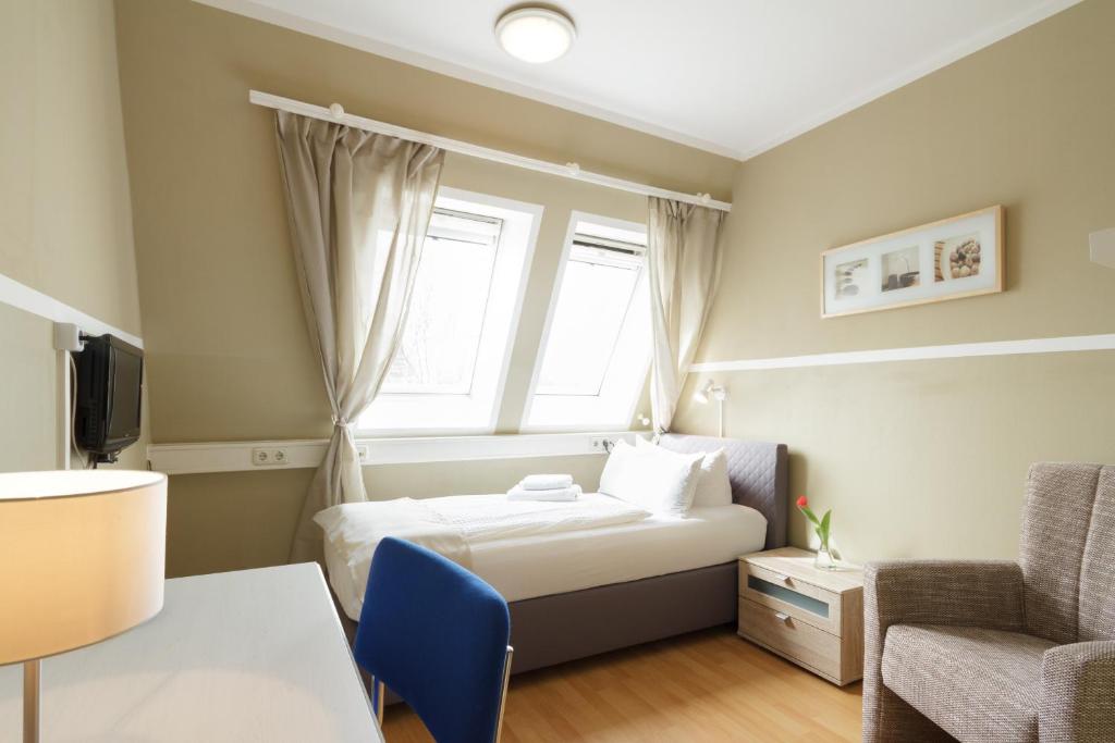 Postel nebo postele na pokoji v ubytování Hotel Pankow