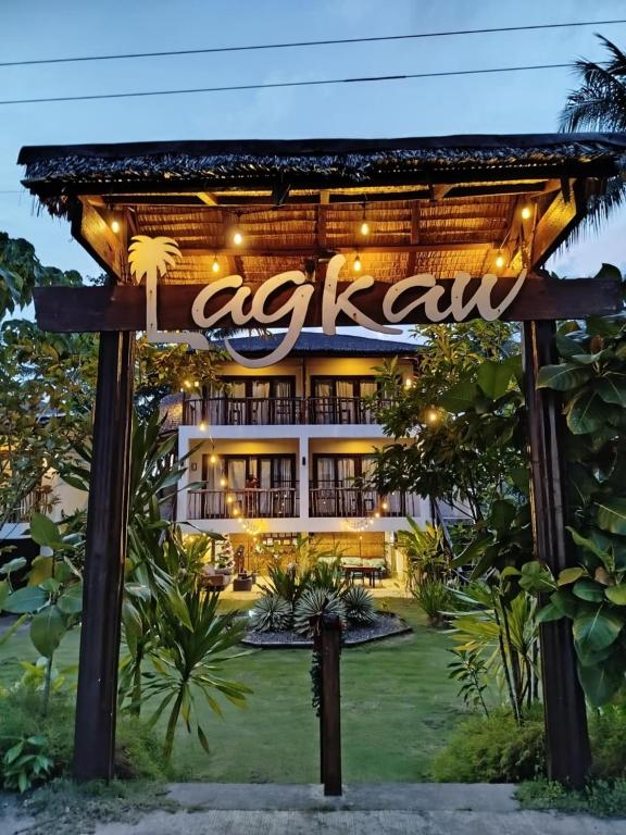 a resort with a sign in front of it at Lagkaw Siargao Villas in General Luna