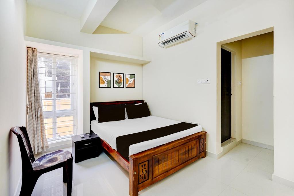 Postel nebo postele na pokoji v ubytování Collection O Sholinganallur Chennai Formerly Nimalan Residenc