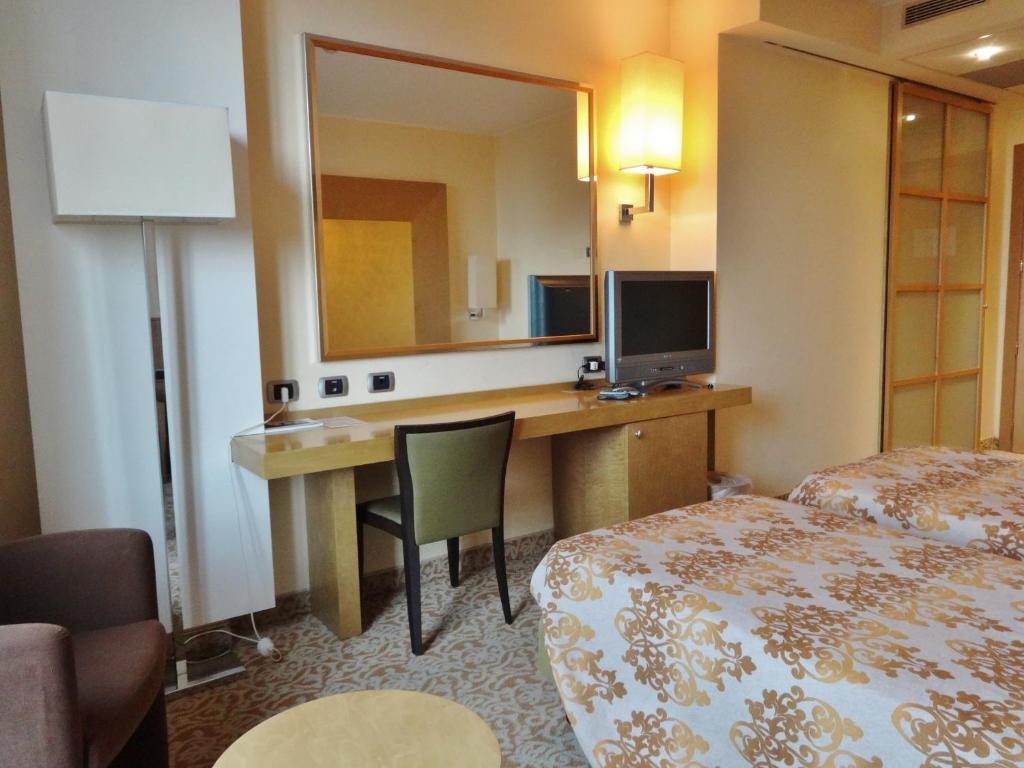Posteľ alebo postele v izbe v ubytovaní Hotel Tiffany Milano