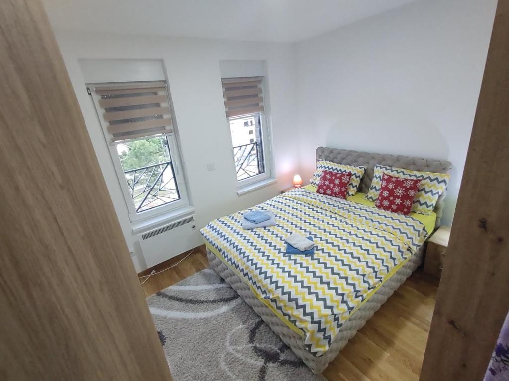 Ένα ή περισσότερα κρεβάτια σε δωμάτιο στο Apartman STEFAN