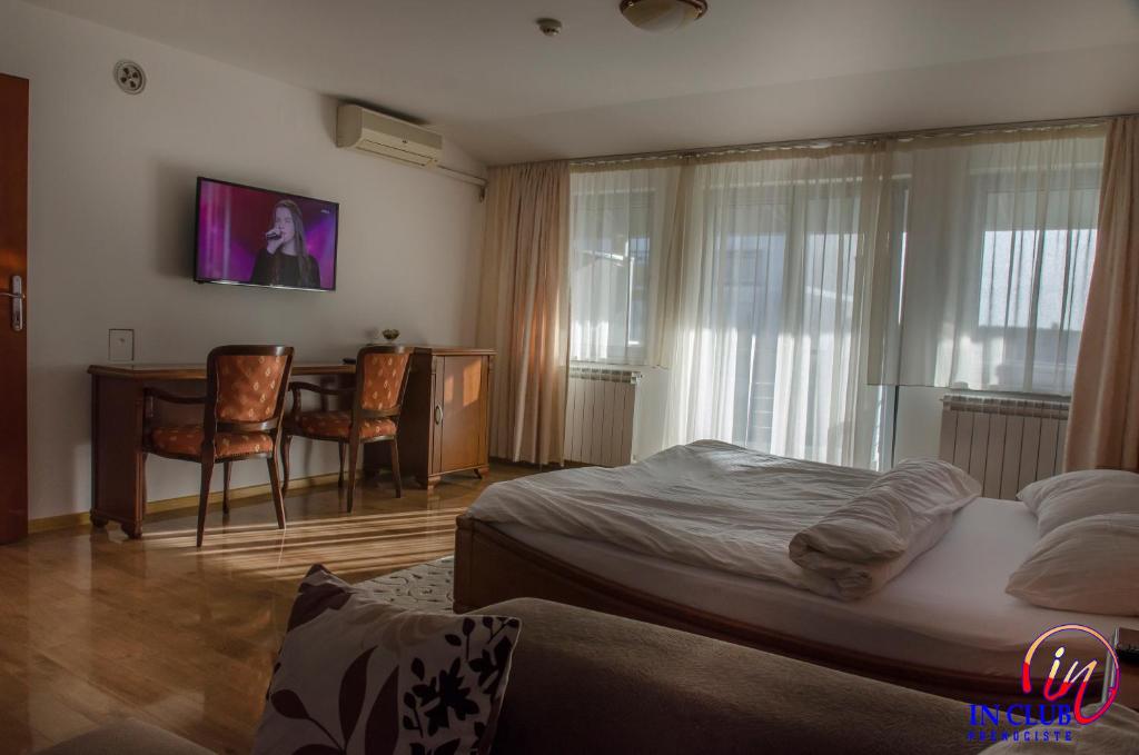 Postel nebo postele na pokoji v ubytování Apartment and Rooms In Club