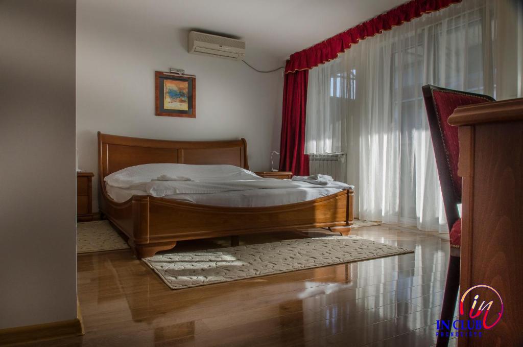 Postel nebo postele na pokoji v ubytování Apartment and Rooms In Club