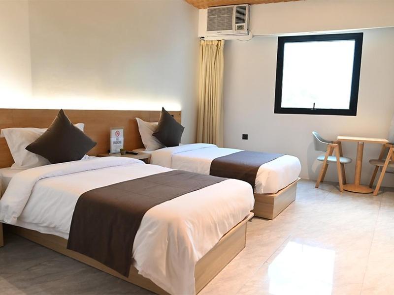 Postel nebo postele na pokoji v ubytování Terra Hotel Kawit