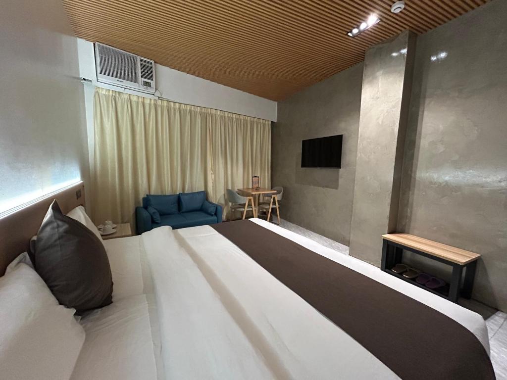 Postel nebo postele na pokoji v ubytování Terra Hotel Kawit