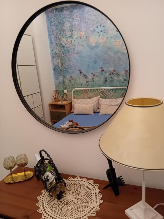 Hotel Chic Cozy Quiet DELUXE Citycenter in ASTORIA with AC, a mirror on a wall next to a bedroom at Chic Cozy Quiet DELUXE Citycenter in ASTORIA with AC in Budapest