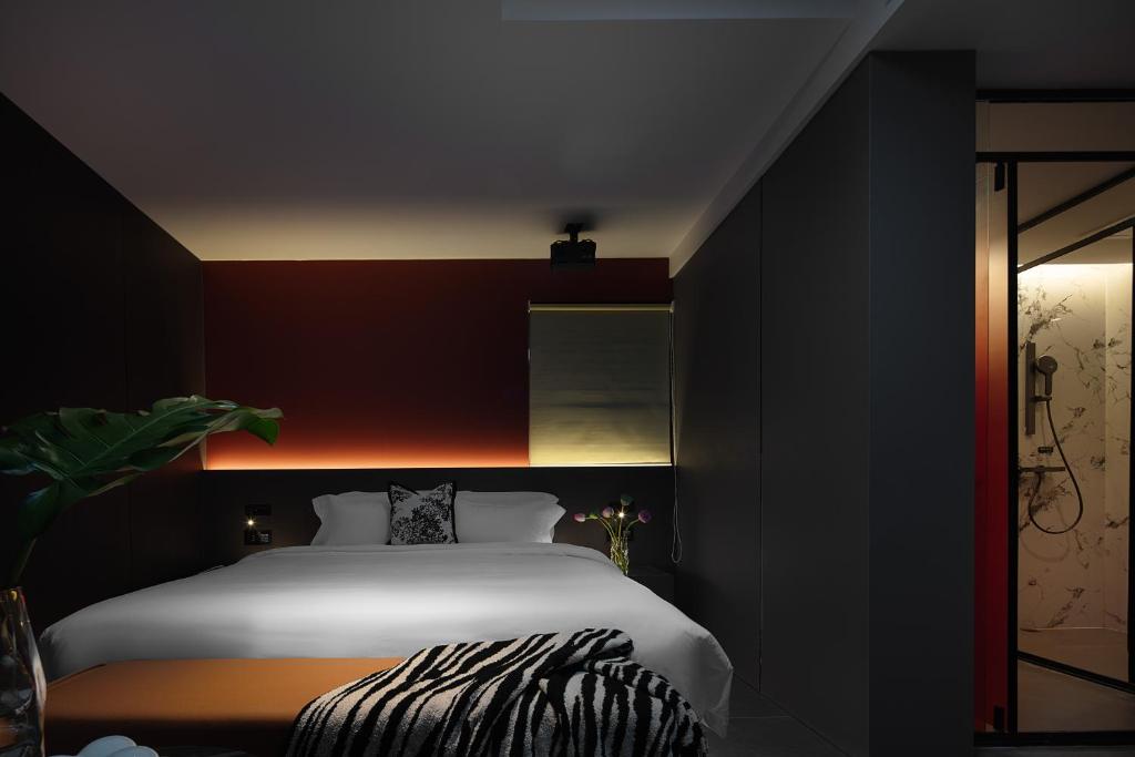 Postel nebo postele na pokoji v ubytování Enji M Hotel-Xi’an datangbuyecheng