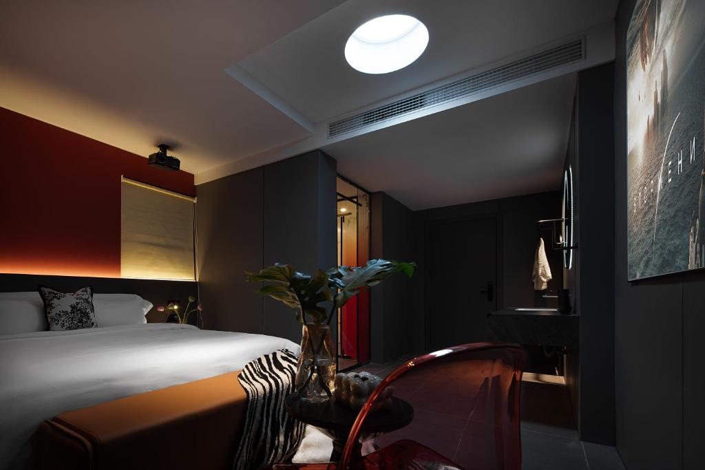 Postel nebo postele na pokoji v ubytování Enji M Hotel-Xi’an datangbuyecheng