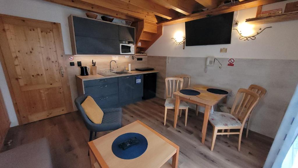 Kuchyň nebo kuchyňský kout v ubytování Aquapark Tatralandia BEST Apartman 335 Liptov
