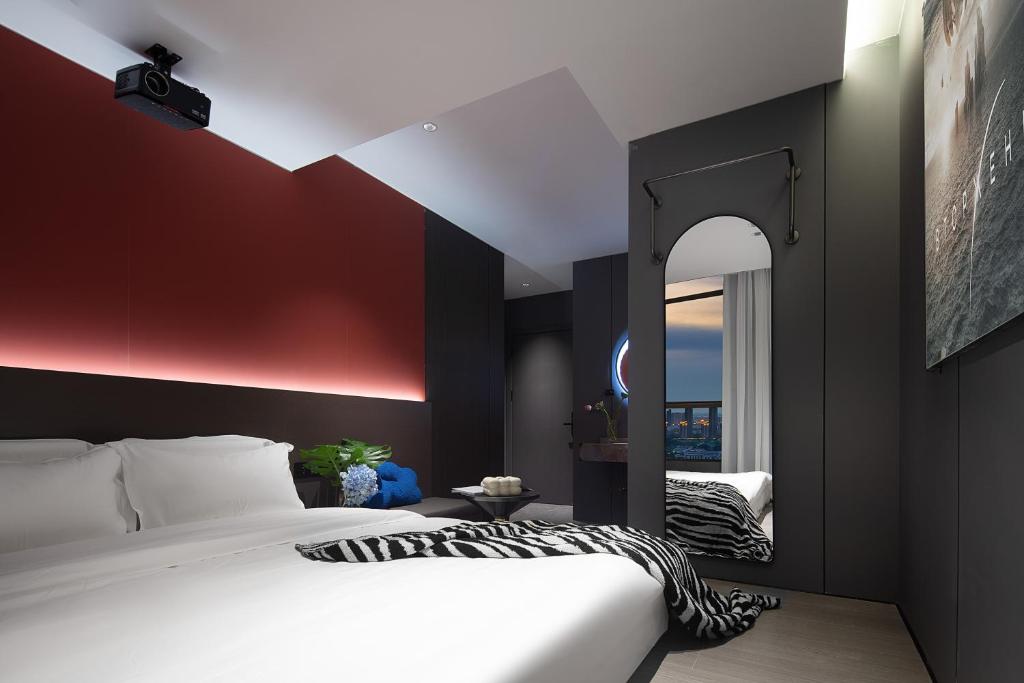Postel nebo postele na pokoji v ubytování Enji M Hotel-Xi’an datangbuyecheng