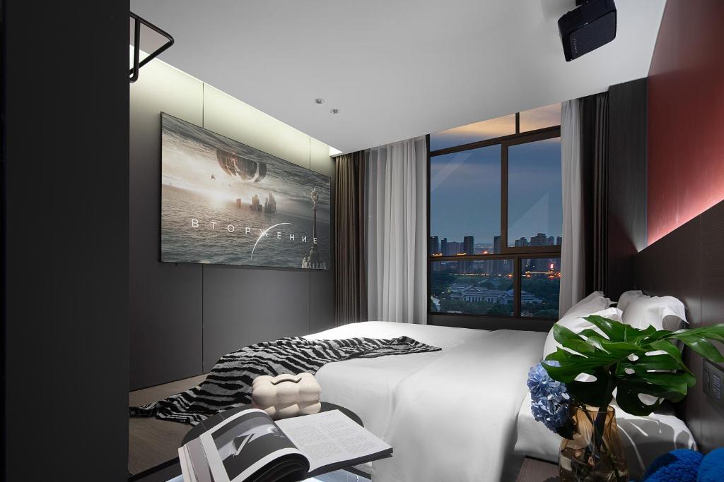 Postel nebo postele na pokoji v ubytování Enji M Hotel-Xi’an datangbuyecheng