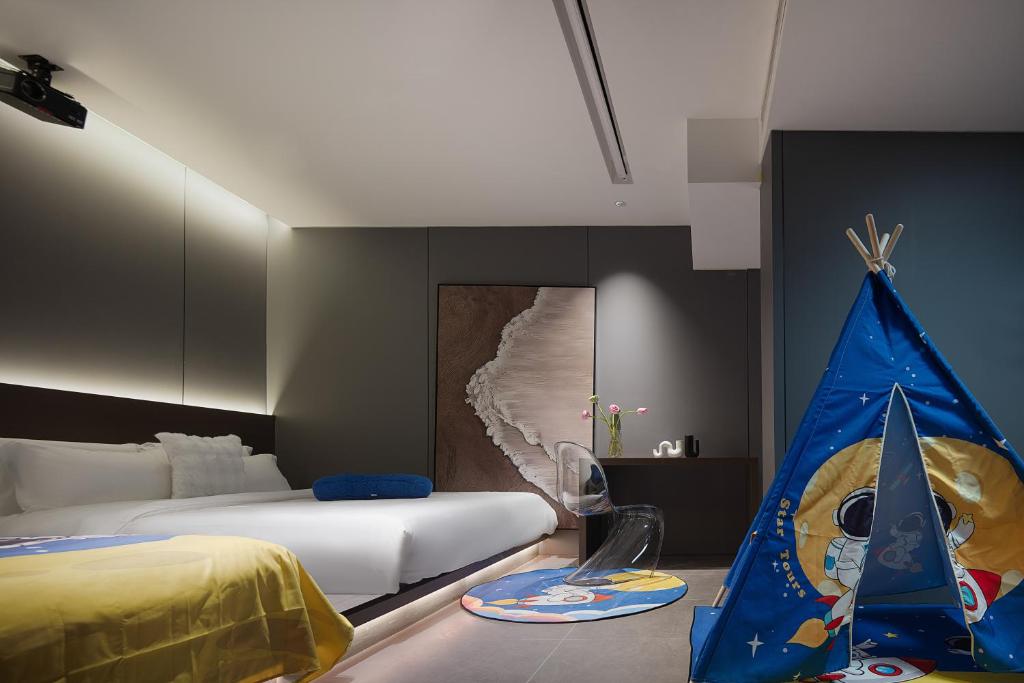 Postel nebo postele na pokoji v ubytování Enji M Hotel-Xi’an datangbuyecheng