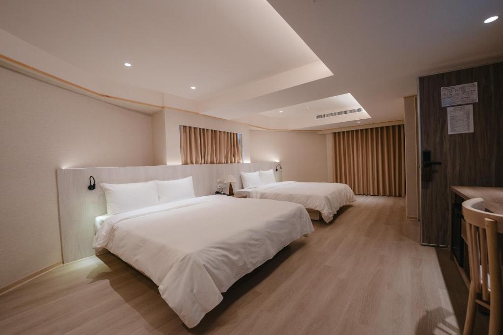 Postel nebo postele na pokoji v ubytování 衿后禾居Good Hotel