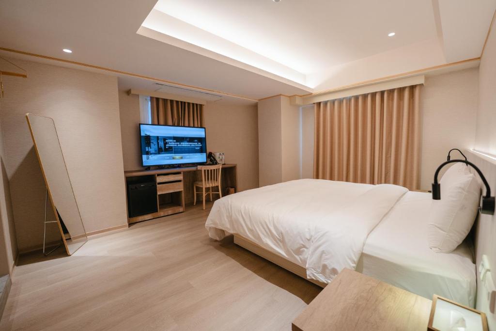 TV a/nebo společenská místnost v ubytování 衿后禾居Good Hotel