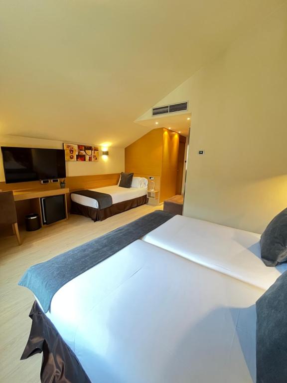 Postel nebo postele na pokoji v ubytování Wuau! Hotel Galanthus & Spa