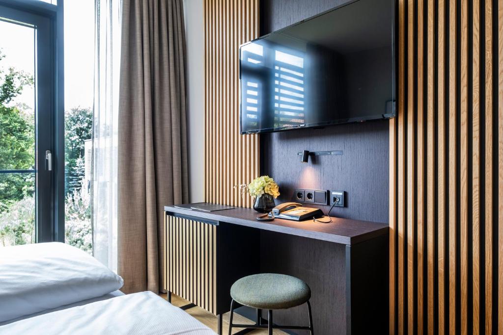 Postel nebo postele na pokoji v ubytování Hotel Breitenburg