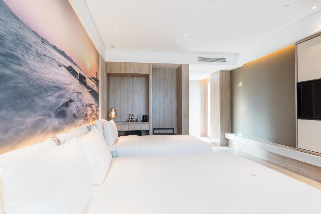 TV a/nebo společenská místnost v ubytování Atour Hotel Xiamen Jimei University
