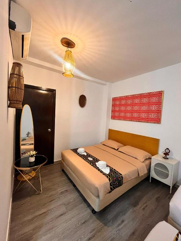 Postel nebo postele na pokoji v ubytování Nunuk Ragang Hotel