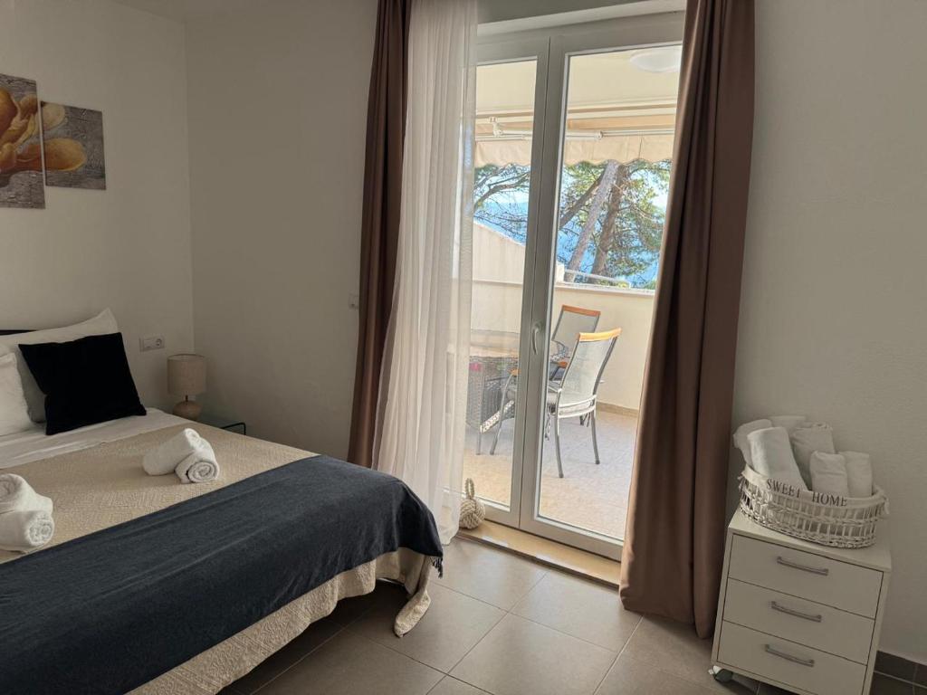 Postel nebo postele na pokoji v ubytování Apartments Domani