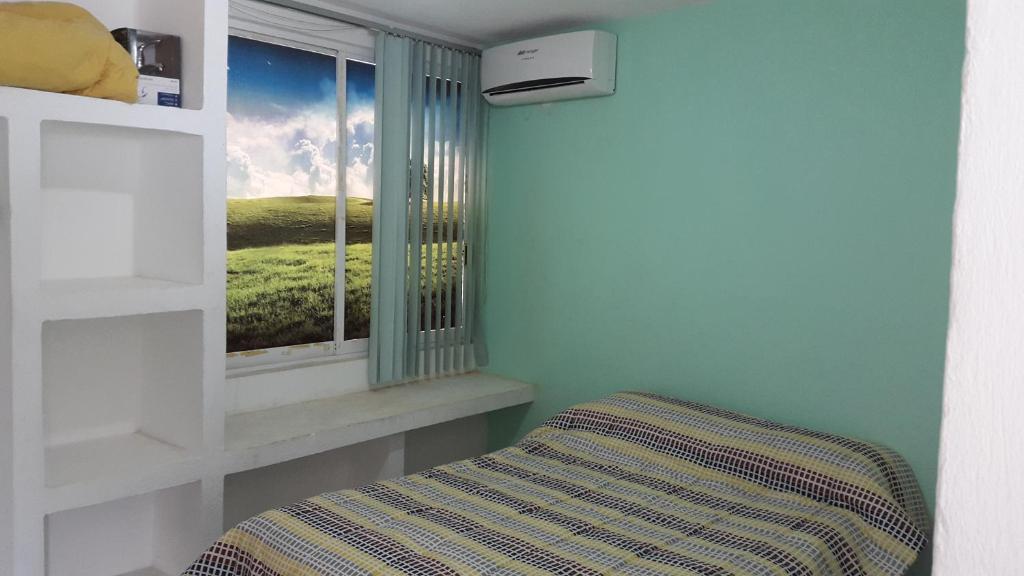 Postel nebo postele na pokoji v ubytování Casa Horizonte Azul Acapulco