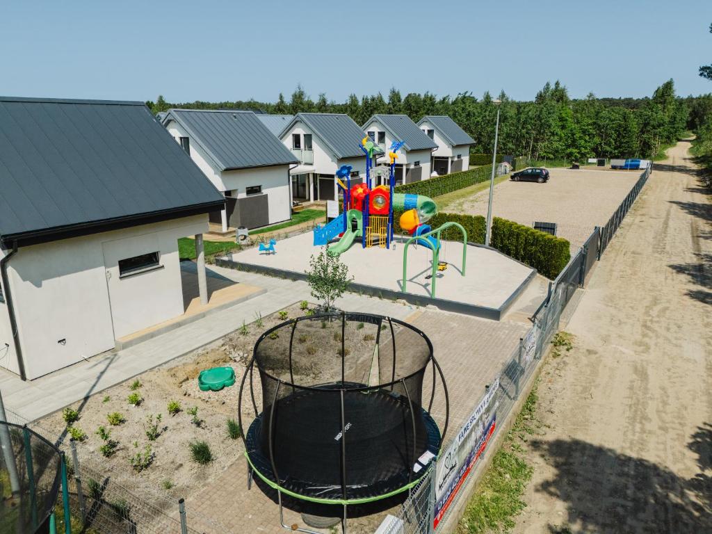 an aerial view of a playground at a house at Domki Morski Raj A in Dębki