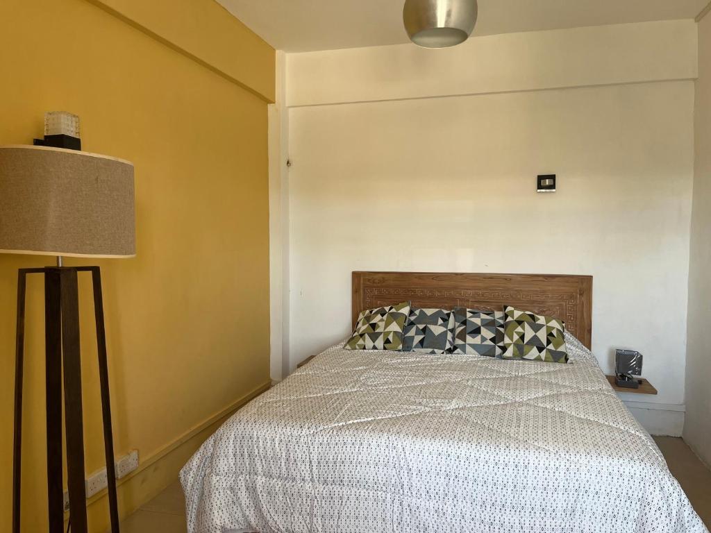 Postel nebo postele na pokoji v ubytování Fortuna Beach