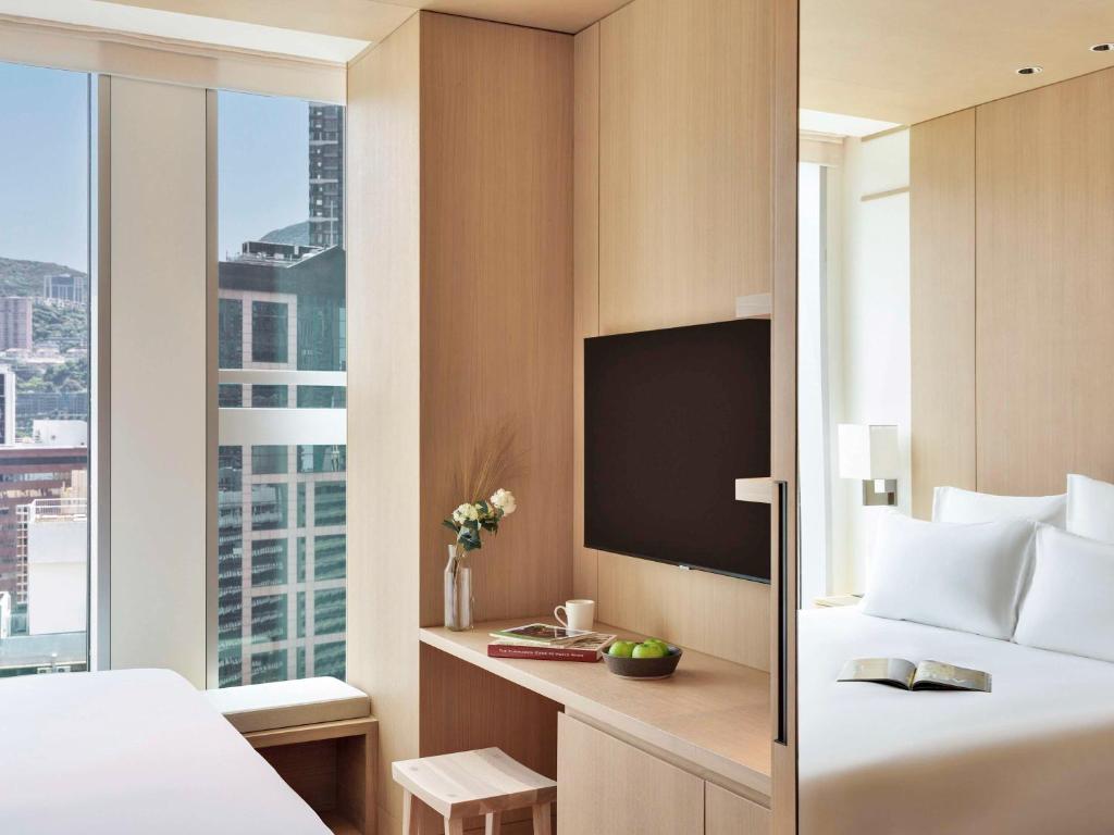Letto o letti in una camera di AKI Hong Kong - MGallery