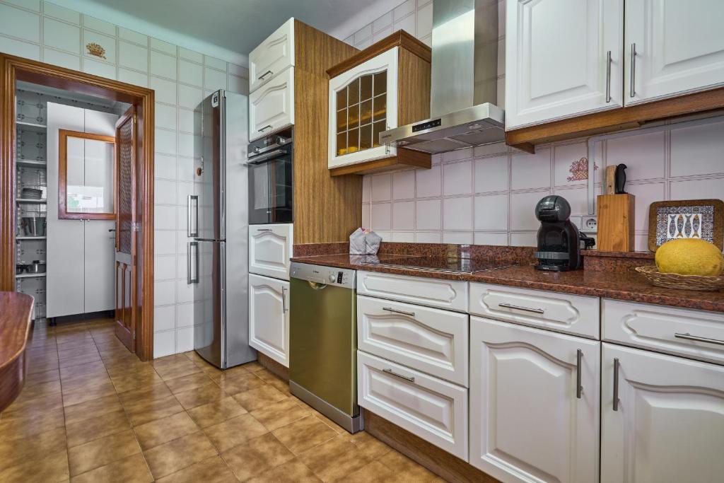 Kuchyň nebo kuchyňský kout v ubytování Villa Retorn