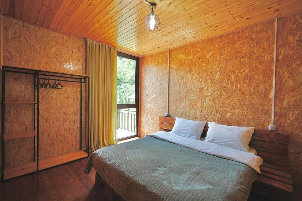 Postel nebo postele na pokoji v ubytování Nahei Cottage Martvili