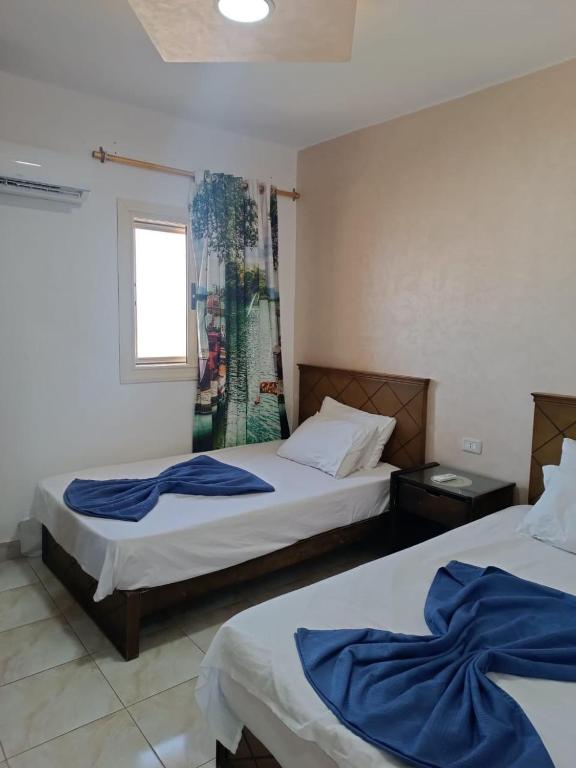 Postel nebo postele na pokoji v ubytování Ras El Bar Apartments Armed Forces
