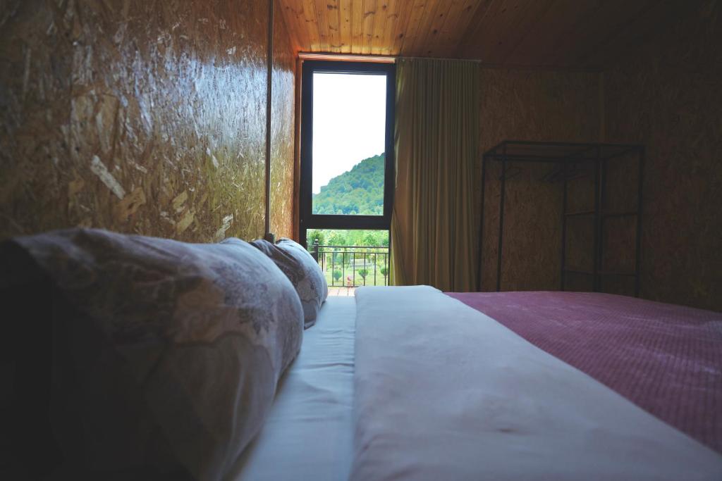 Postel nebo postele na pokoji v ubytování Nahei Cottage Martvili