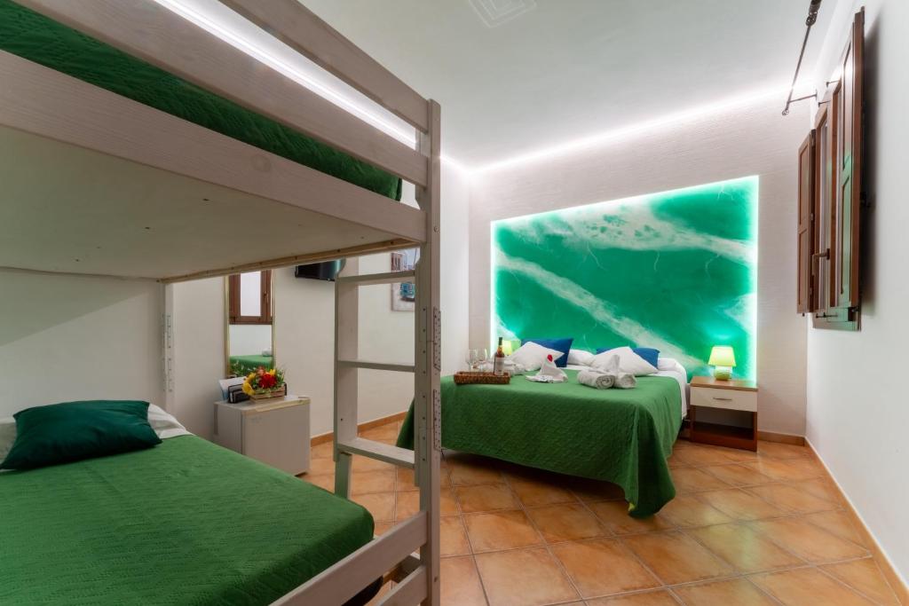 Postel nebo postele na pokoji v ubytování "L'Oasi di Favignana" Room and Charme