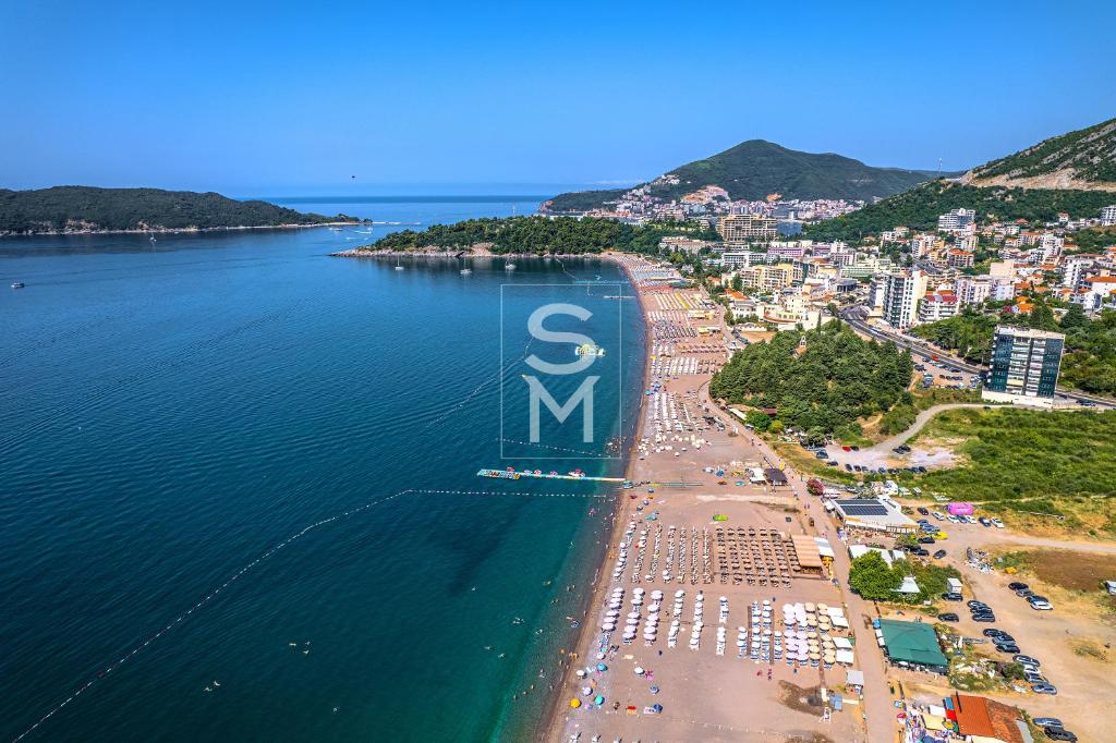an aerial view of a beach with a large sign at Status-M Apartments 176 in Bečići