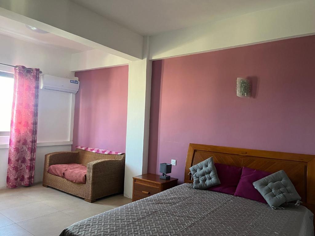 Postel nebo postele na pokoji v ubytování Fortuna Beach