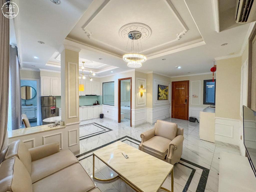 a living room with two chairs and a table at KING Hotel in Vung Tau