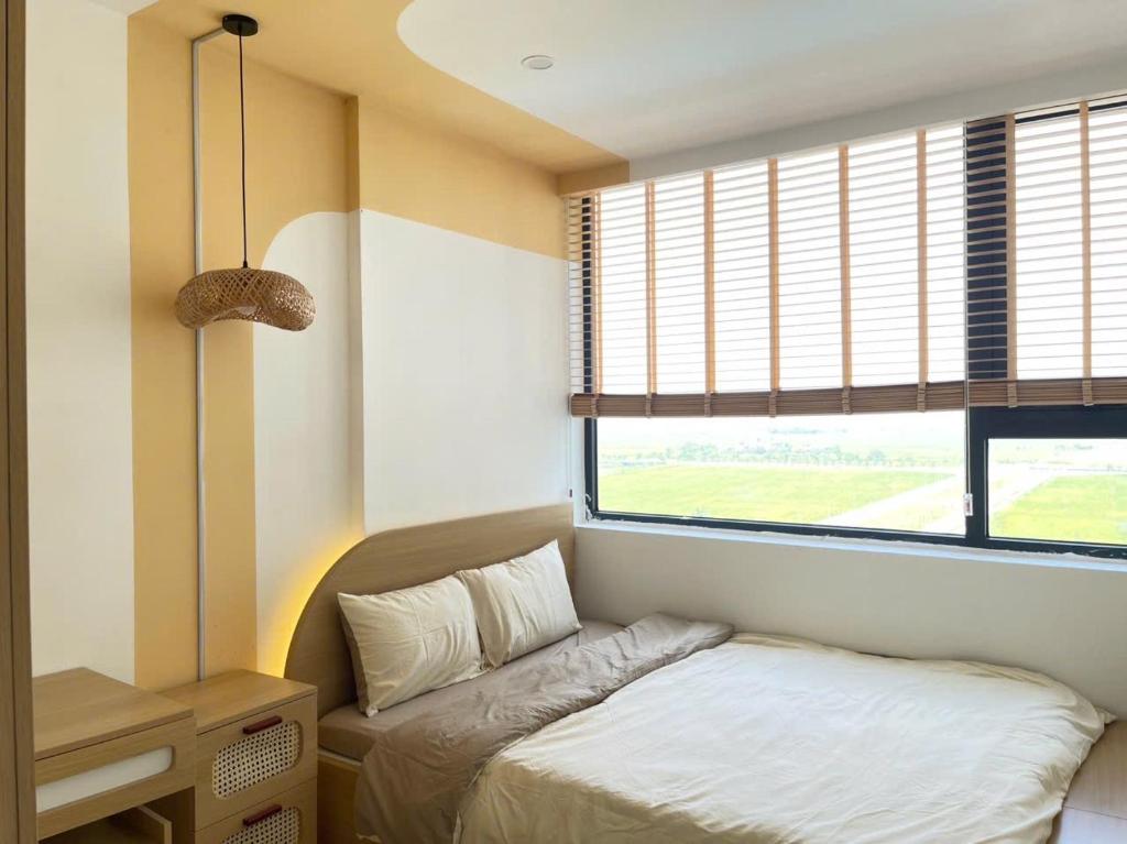 Ένα ή περισσότερα κρεβάτια σε δωμάτιο στο Mina Homestay Pool & Gym free Nera garden