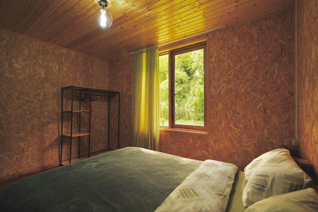 Postel nebo postele na pokoji v ubytování Nahei Cottage Martvili