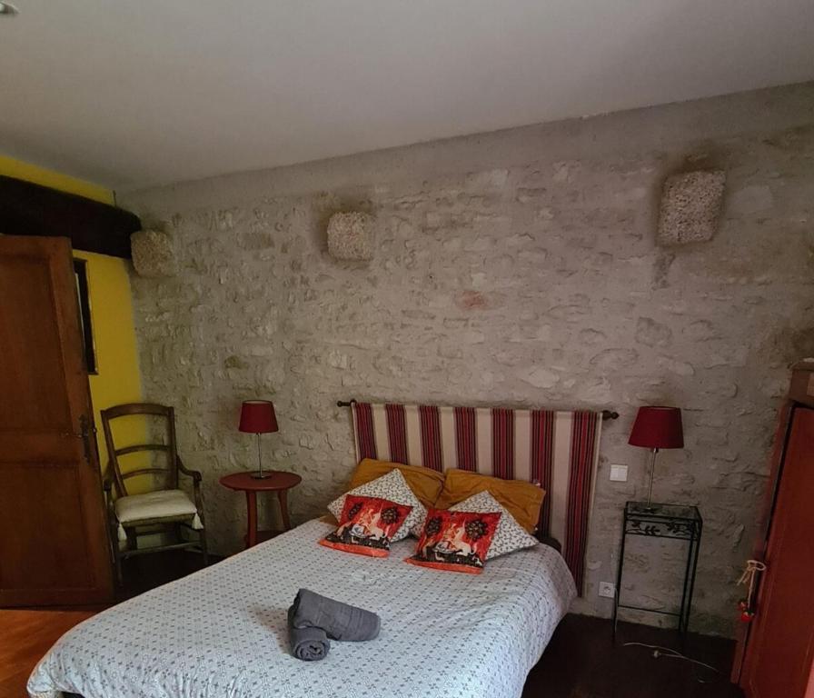 Posteľ alebo postele v izbe v ubytovaní Dans la Cité de Rocamadour L'Oustal de Beline