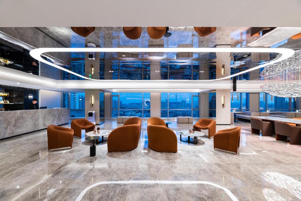 Posezení v ubytování Qingdao Shandong Road Mixc Orange Crystal Hotel