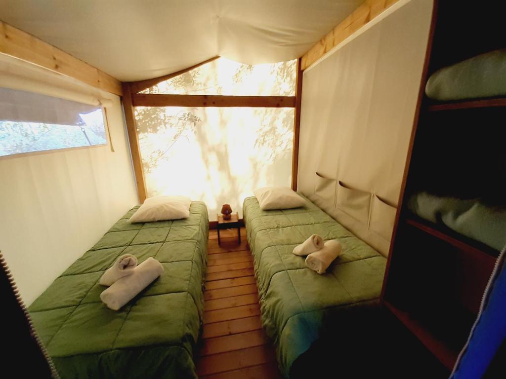 Postel nebo postele na pokoji v ubytování Camping la Venise Verte