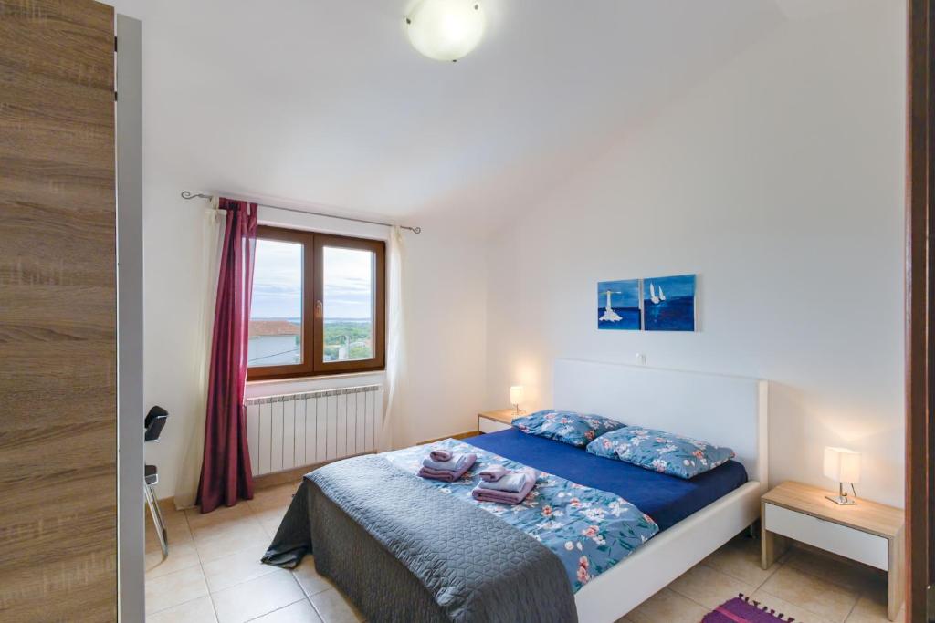 Postel nebo postele na pokoji v ubytování Villa Krasa sea view apartmants with pool
