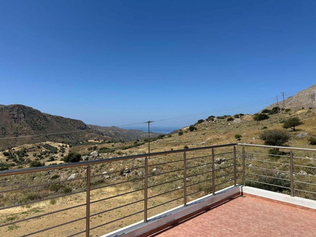 a balcony with a view of a mountain at Anna Holiday House, eco-friendly! in Kría Vrísi