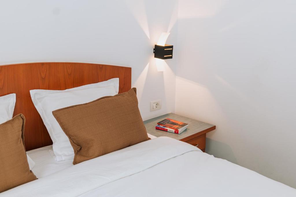 Postel nebo postele na pokoji v ubytování Hotel Duke Romana City Center