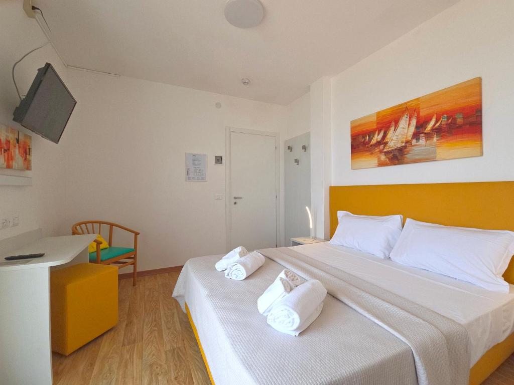 Posteľ alebo postele v izbe v ubytovaní Hotel Royal Garnì