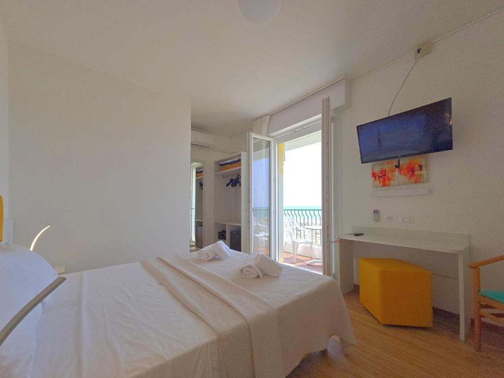 Posteľ alebo postele v izbe v ubytovaní Hotel Royal Garnì