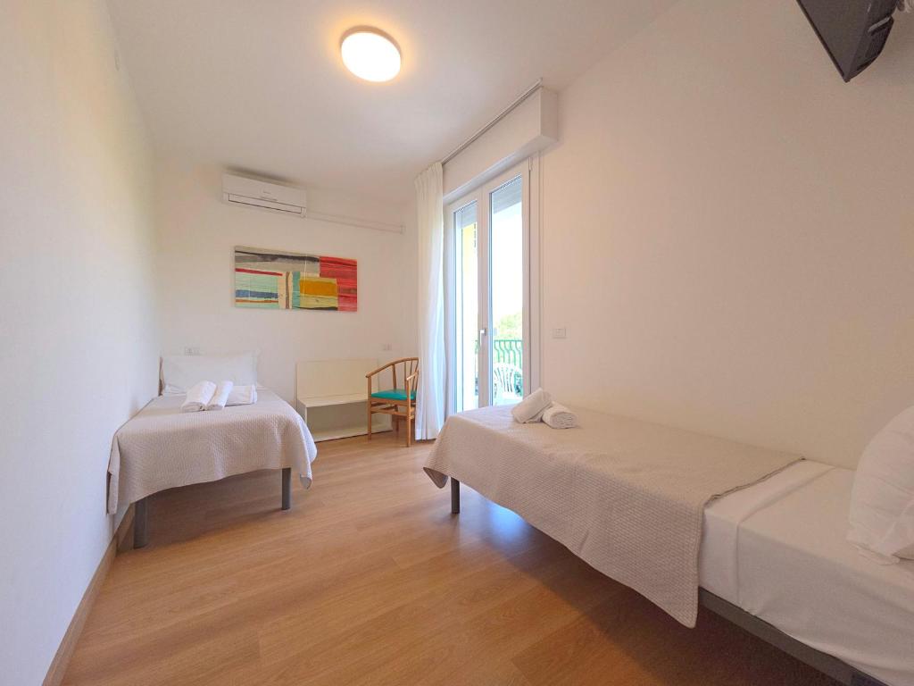Posteľ alebo postele v izbe v ubytovaní Hotel Royal Garnì