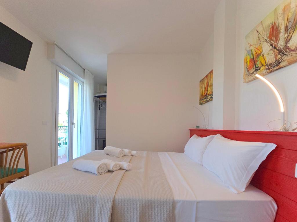 Posteľ alebo postele v izbe v ubytovaní Hotel Royal Garnì