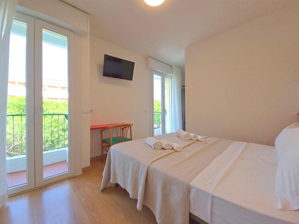 Posteľ alebo postele v izbe v ubytovaní Hotel Royal Garnì